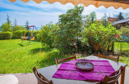 Susello Apartment | Attractive studio with terrace and garden, pool and dream view