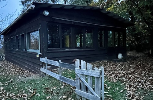 Tilh Ski Chalet | Atypical, secluded chalet in a forest garden, with covered terrace.
