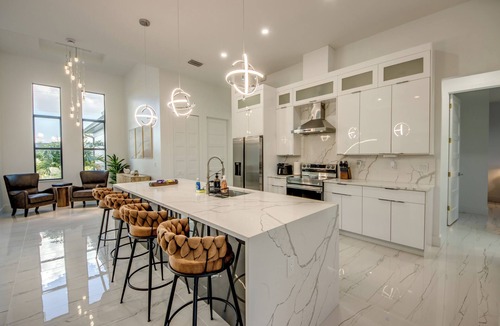 Pelican Villa | Awesome 4 BR/3 bath waterfront villa w. heated pool, hot tub, kayaks, fishing poles, bikes