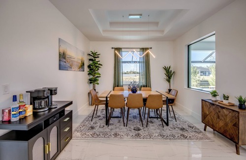 Pelican Villa | Awesome 4 BR/3 bath waterfront villa w. heated pool, hot tub, kayaks, fishing poles, bikes