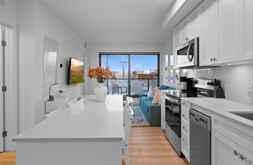 Crescent Heights Apartment | "Baja Blast" 2BR |Mins to Stampede | Rooftop Patio