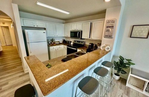 Florida Central Atlantic Coast Apartment | Balcony Lake Views | Pool, Gym, WiFi & Parking