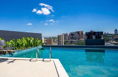 Bigorrilho Apartment | Batel Studio Rooftop Pool, Jacuzzi & Gym