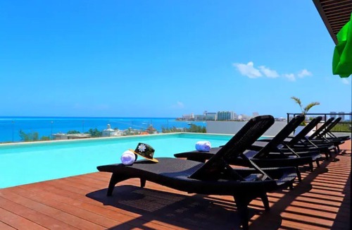 Zona Hotelera Condo | Beach 2 min walk, rooftop pool+Tours & Car Rental
