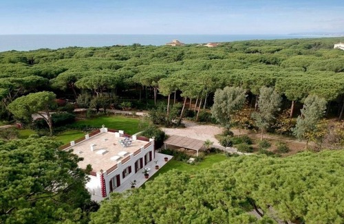 Marina di Bibbona Villa | Beach front Casa Rossa, a modern seaside villa, surrounded by a beautiful garden with lawn and r.