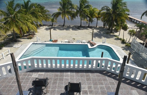 Boca Ciega Villa | Beach front in welcoming San Pedro w/AC, pool, fitness room, WiFi, kitchenette