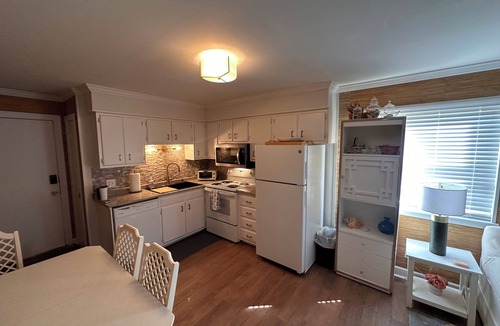 Gulf Stream Estates Condo | Beach Haven Ground Floor Walk to Beach Pool + Fishing Dock Gated