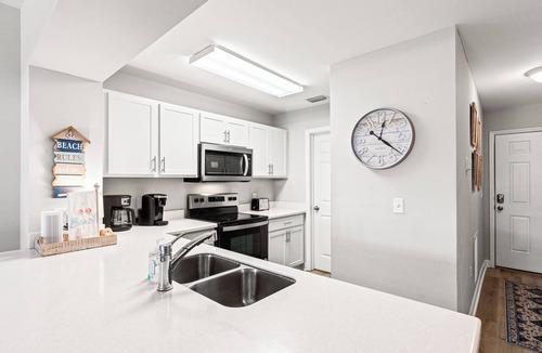 Waterside Village Condo | Beach Please - Waterside Village Condo 105 - Pet Friendly - Steps from the BEACH-Pool & Hot Tub-Boat Dock