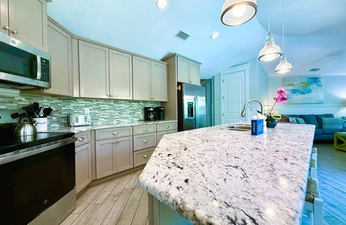 Holmes Beach House | Beach Time AMI! Pet Friendly Home with Pool, Hot Tub and Walk to Beach