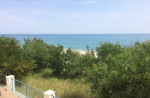 Brancaleone Apartment | Beachfront apartment in prime position with rooftop terrace, balcony and patio.