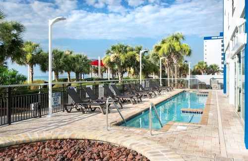 Downtown Myrtle Beach Apartment | Beachfront Beauty: King Room with Scenic Balcony