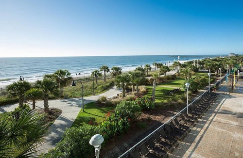 Downtown Myrtle Beach Apartment | Beachfront Beauty: King Room with Scenic Balcony