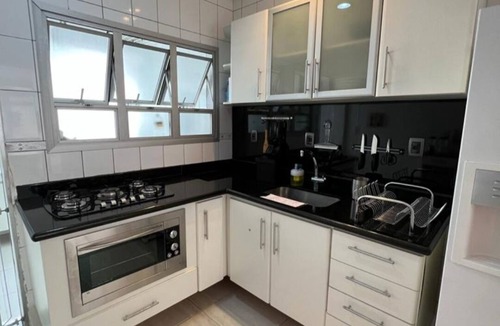 Gonzaga Apartment | Beachfront building on Gonzaga beach with designated parking space.