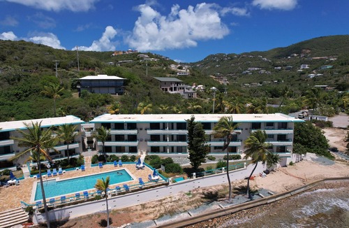 Estate Bolongo Apartment | Beachfront Condominium + bar/restaurant on-site: LeBlu