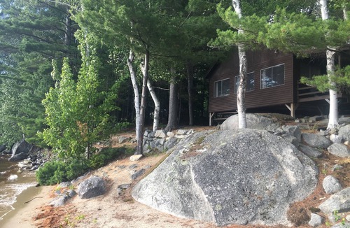Millinocket Cabin | Beachfront Cottage on Ambajejus Lake With Sandy Beach and a Mountain View