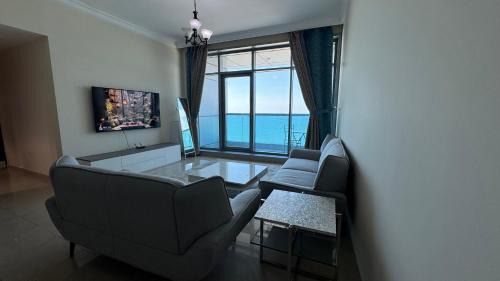 Rumailah Apartment | Beachfront holiday homes with beach,sauna,jacuzzi,cafe,restaurants and more