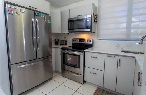 Ensenada House | Beachfront in gated community with patio, balcony, pool, close to all in Rincón