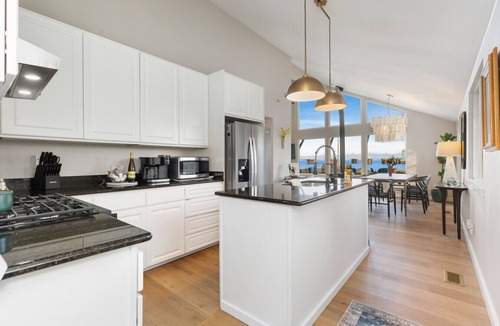 Clinton House | Beachfront Retreat with Hot Tub, Kayaks & Fire pit