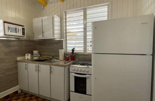El Combate Cabin | Beachfront Rustic Cabin by Sunset Village - Yellow