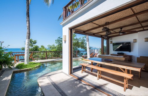 South Shore Hotel Area House | Beachfront Steps from Romantic Zone: Casa Cuatro Abrazos (Lower Half)