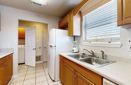 Sugar Beach House | Beachfront townhome w/on-site beach access, heated pool, patio, grill, AC, W/D