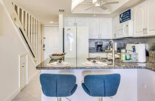 Indian Rocks Beach Apartment | Beachfront condo with a view of the water, a pool, a sundeck, a private balcony, and a washer and dryer