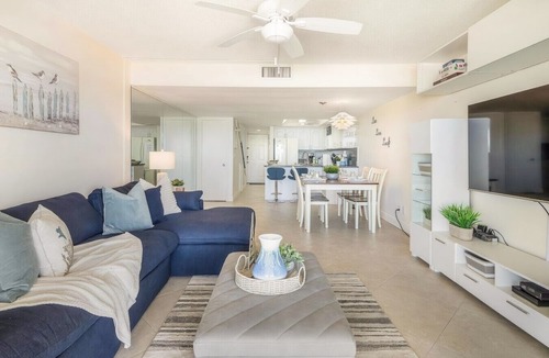 Indian Rocks Beach Apartment | Beachfront condo with a view of the water, a pool, a sundeck, a private balcony, and a washer and dryer