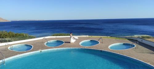 Goudhouros Villa | Beachfront Villa Atalandia with Heated Pools, Gym, BBQ & Office