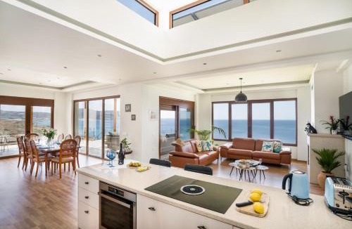Goudhouros Villa | Beachfront Villa Atalandia with Heated Pools, Gym, BBQ & Office