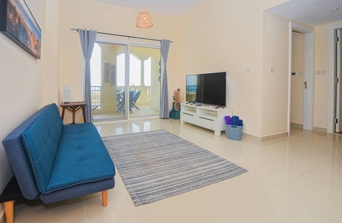 Al Hamra Village Apartment | Beachside Bliss Getaway