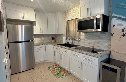 Fort Pierce Shores House | Beachside Bliss Indulge in Ultimate Tranquility <2 Block Walk W/SwimSpa & HotTub