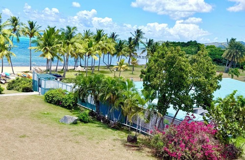 Estate Golden Rock Condo | Beachside Bliss: View paradise from your balcony! 2 Bedroom/2 Baths/2 Balconies!