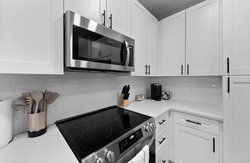 Deerwood Apartment | Beachy Bliss: Elegant 2BR/2BA with Pool & Gym