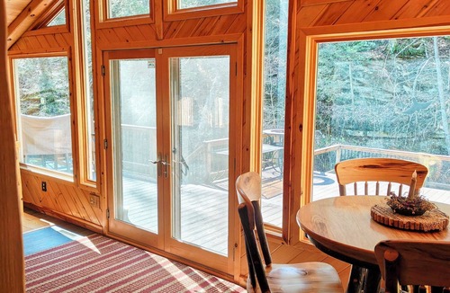 Dayton Cabin | Beautiful 2 BR cabin with a wall of windows overlooking the deck and stream.