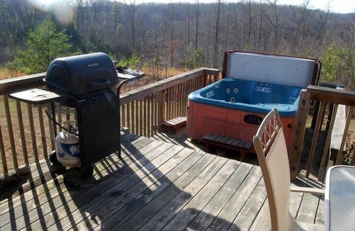 Beattyville Cabin | Beautiful, authentic log cabin with acres of land, fishing pond, and hot tub.