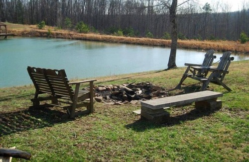 Beattyville Cabin | Beautiful, authentic log cabin with acres of land, fishing pond, and hot tub.