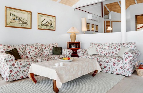 Handrup Strand House | Beautiful, bright cottage with large wooden terrace and sea view.