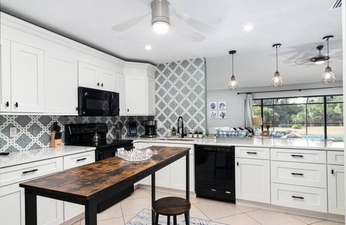 Rural Estates Villa | Beautiful Canal Front Home with Pool, Tennis Court