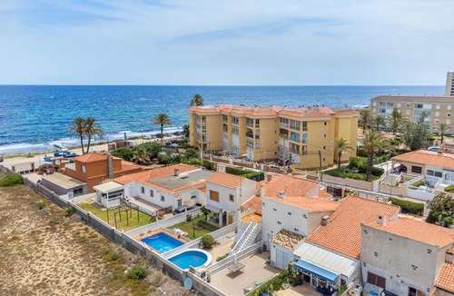 Punta Prima Ski Chalet | Beautiful house with sea views and private pool