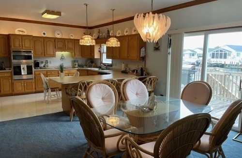 Caine Woods House | Beautiful, modernized four bedroom house located off the bay with sauna, and WiFi just a few blocks from the beach!