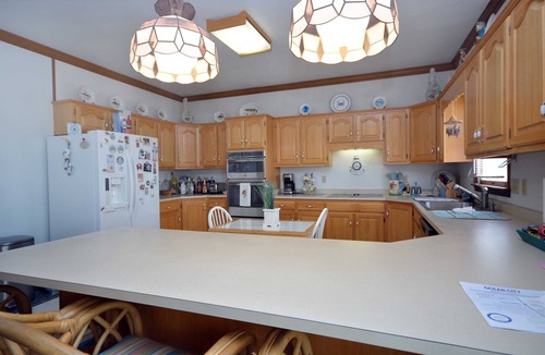 Caine Woods House | Beautiful, modernized four bedroom house located off the bay with sauna, and WiFi just a few blocks from the beach!