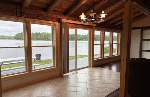 Ellsworth House | Beautiful private beach area within steps from the modern updated log home