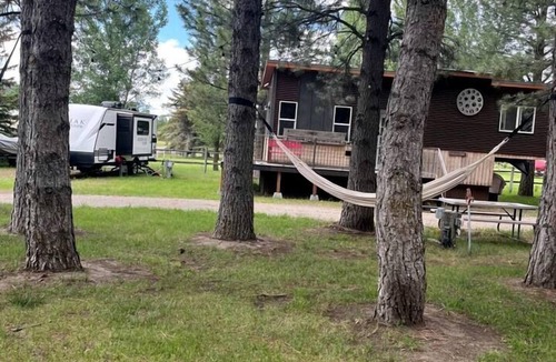 Irwin Cabin | Beautiful Tiny House with Wrap-Around Deck and Skylight for a Romantic Escape in Irwin, Idaho