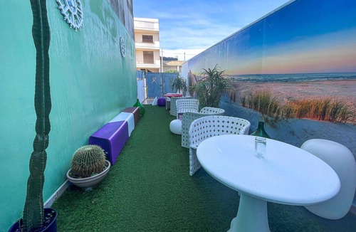 Aradeo Apartment | Beautiful vacation home with common courtyard and bar area.