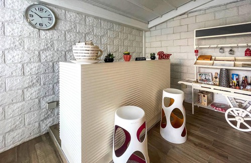 Aradeo Apartment | Beautiful vacation home with common courtyard and bar area.