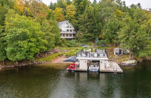 Windermere Cottage | Beautifully landscaped with a sandy beach, outdoor sauna, hot-tub and ample water toys.
