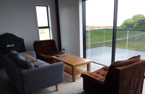Waiotahi House | Big Black Beachfront Bach in family friendly community.