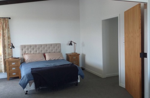 Waiotahi House | Big Black Beachfront Bach in family friendly community.