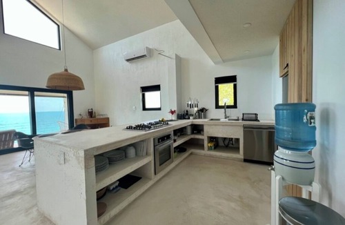 Gregory Town House | Big Pink: mid-century modern 2bedroom oceanfront home on cliffs of Gregory Town