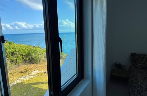 Gregory Town House | Big Pink: mid-century modern 2bedroom oceanfront home on cliffs of Gregory Town